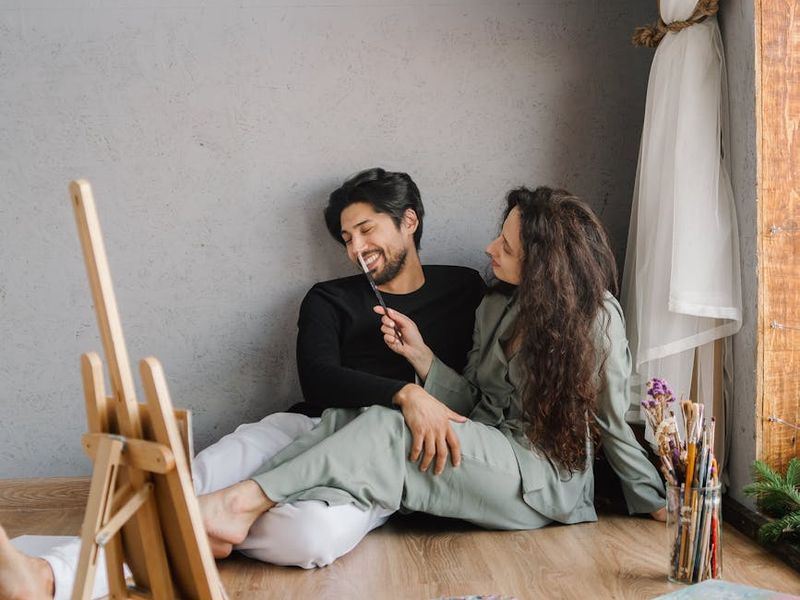 Person performing a flowing yoga sequence in a bright room.