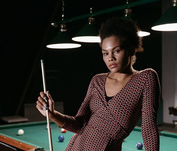 Woman holding a challenging balance yoga pose with confidence.